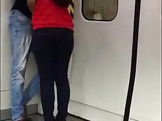 Indian students getting cozy in delhi metro kissing